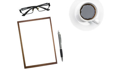High angle view of coffee cup on white background