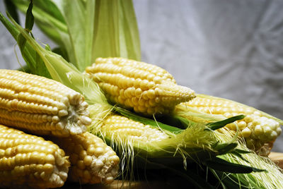 Close-up of sweetcorns on table