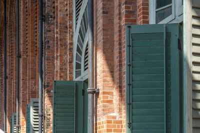 Low angle view of window on wall of building