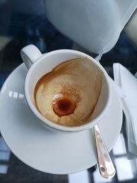 High angle view of coffee in cup on table