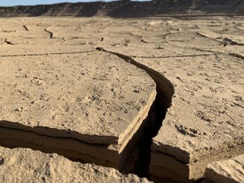 High angle view of old shadow on sand