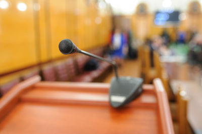 Close-up of microphone in auditorium