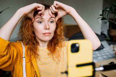 Portrait of young woman looking away