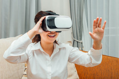 Midsection of woman using mobile phone