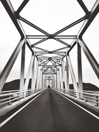 Bridge over road against sky