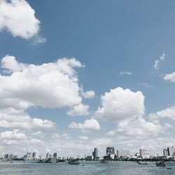 View of city against cloudy sky