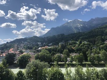 Scenic view of trees and mountains against sky