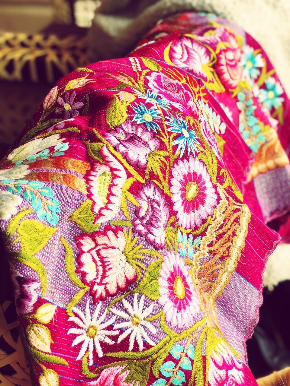 CLOSE-UP OF MULTI COLORED FLOWER PETALS ON PINK FLOOR