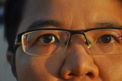 Close-up portrait of man wearing eyeglasses