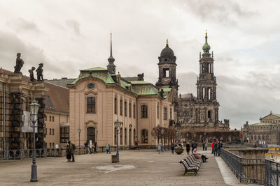 Group of people in front of buildings in city