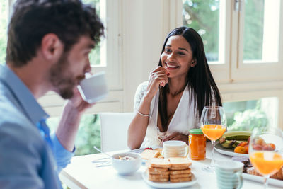 Couple having breakfast at table