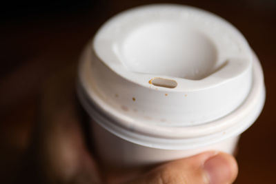 Close-up of hand holding cup