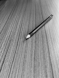 High angle view of pencils on wooden table