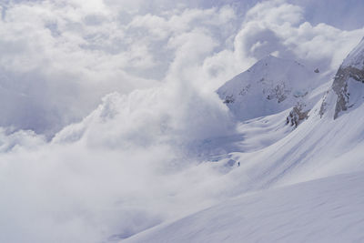 Scenic view of snow mountains against sky