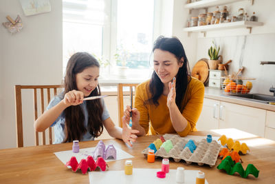 Women sitting on table