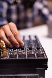 Midsection of woman using sound mixer