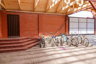 Bicycles parked against wall