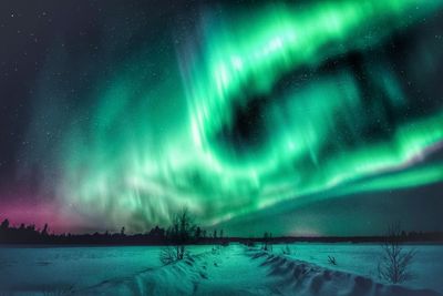 Scenic view of dramatic sky during winter at night