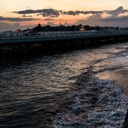 Scenic view of sea against sky at sunset