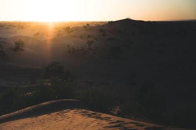 Scenic view of landscape against sky during sunset