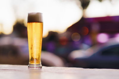 Close-up of beer glass on table