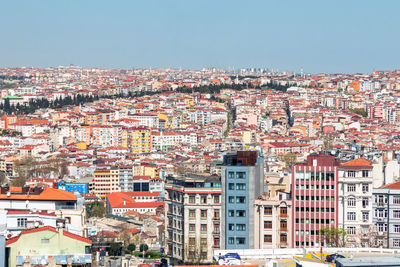 The european part of istanbul turkey, turkiye, panorama on sunny day. colorful houses with red roofs
