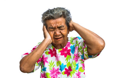 Portrait of mid adult man standing against white background