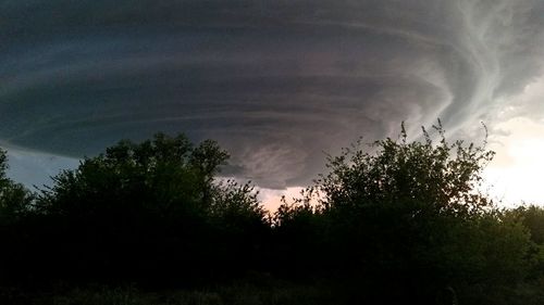 Scenic view of landscape against cloudy sky