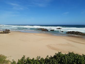 Scenic view of beach against sky