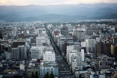 High angle view of buildings in city against sky