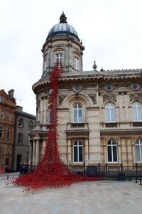 Low angle view of red building against sky