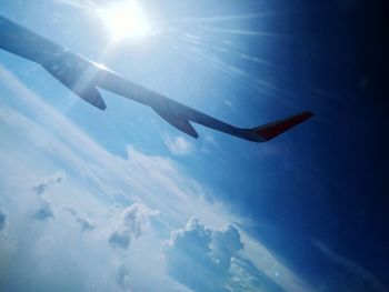 Low angle view of airplane flying in sky