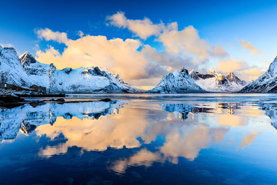 Scenic view of lake against sky during winter