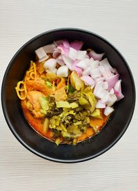 High angle view of chopped vegetables in bowl on table