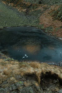 High angle view of water flowing through rocks