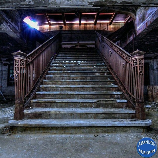 built structure, steps, architecture, steps and staircases, staircase, railing, the way forward, low angle view, building exterior, old, stairs, blue, no people, absence, empty, connection, illuminated, diminishing perspective, metal, wall - building feature