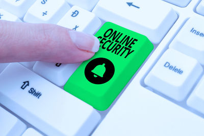 Close-up of hand holding computer keyboard