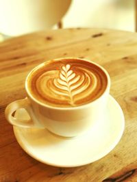 Close-up of cappuccino on table