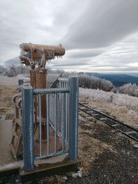 Built structure on field against sky during winter