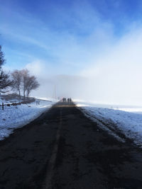 Scenic view of beach against sky during winter