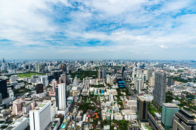 High angle view of modern buildings in city against sky