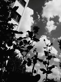 Low angle view of building against cloudy sky