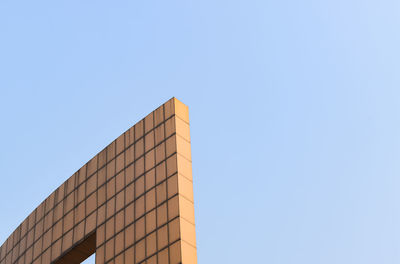 Low angle view of modern building against clear sky