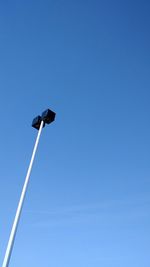 Low angle view of street light against clear blue sky