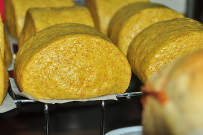 Close-up of yellow food on cooling rack