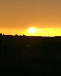 Silhouette of landscape against sky during sunset