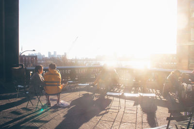 People sitting in park on sunny day