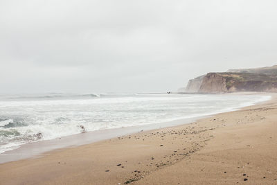 Scenic view of beach against sky