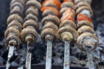 Close-up of sausages on barbecue grill