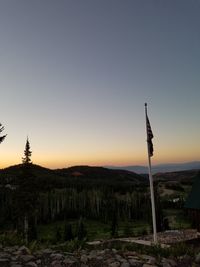 Built structure on land against sky at sunset